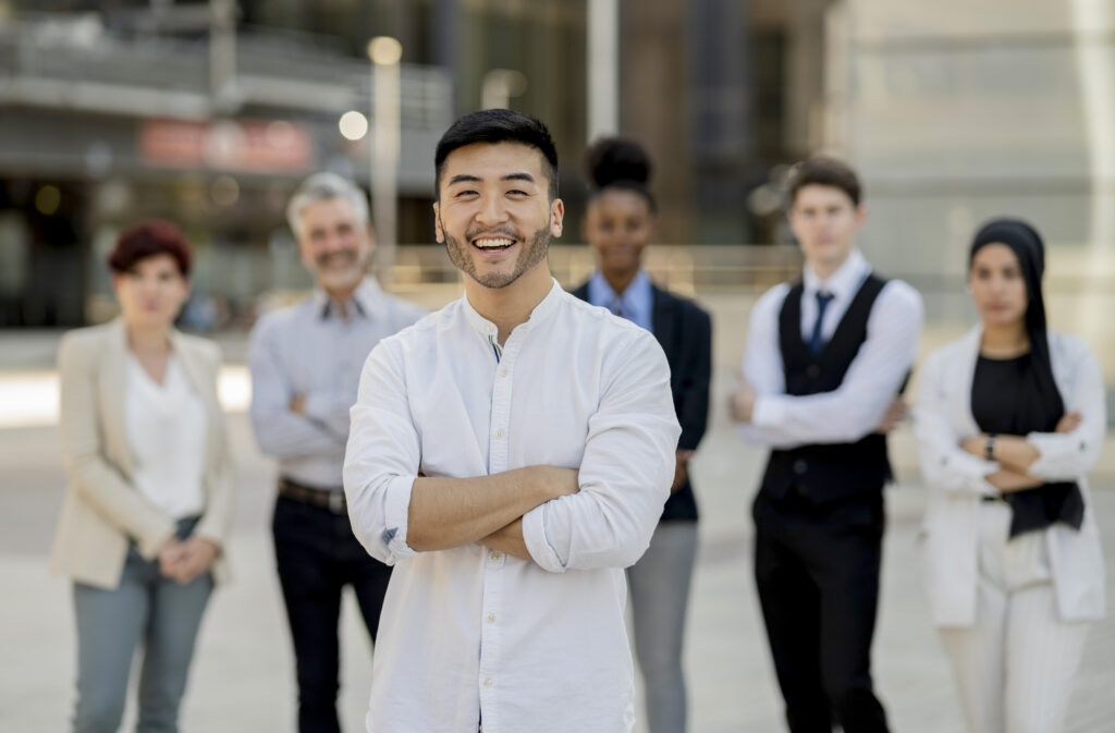 Diverse team supporting a motivated employee starting their first job journey.